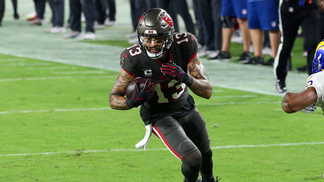 TAMPA, FL - NOVEMBER 23: Mike Evans (13) of the Bucs makes a catch and turns to make a couple more yards during the regular season game between the Los Angeles Rams and the Tampa Bay Buccaneers on November 23, 2020 at Raymond James Stadium in Tampa, Florida.