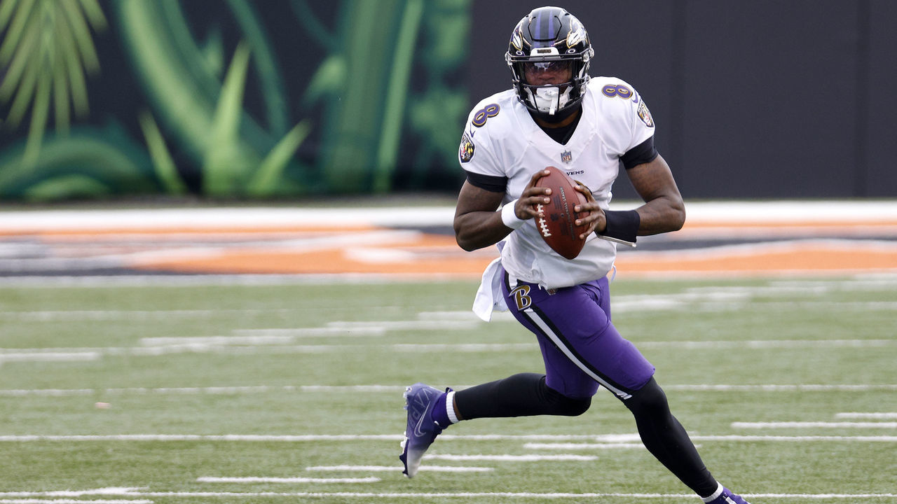 CINCINNATI, OHIO - JANUARY 03: Quarterback Lamar Jackson #8 of the Baltimore Ravens rolls out to pass against the Cincinnati Bengals in the first half at Paul Brown Stadium on January 03, 2021 in Cincinnati, Ohio.