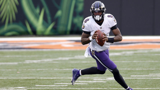 CINCINNATI, OHIO - JANUARY 03: Quarterback Lamar Jackson #8 of the Baltimore Ravens rolls out to pass against the Cincinnati Bengals in the first half at Paul Brown Stadium on January 03, 2021 in Cincinnati, Ohio.