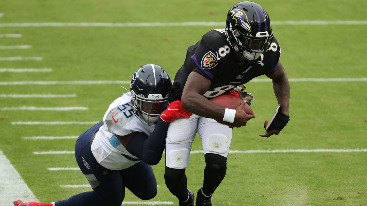 BALTIMORE, MARYLAND - NOVEMBER 22: Quarterback Lamar Jackson #8 of the Baltimore Ravens rushes with the ball against the Tennessee Titans at M&T Bank Stadium on November 22, 2020 in Baltimore, Maryland.