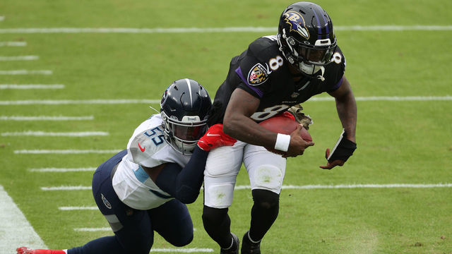 BALTIMORE, MARYLAND - NOVEMBER 22: Quarterback Lamar Jackson #8 of the Baltimore Ravens rushes with the ball against the Tennessee Titans at M&T Bank Stadium on November 22, 2020 in Baltimore, Maryland.