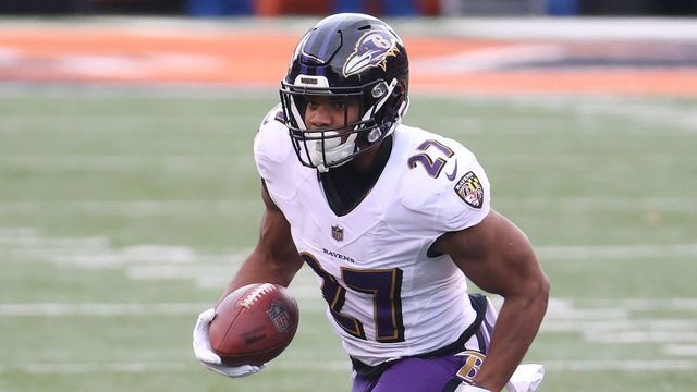 CINCINNATI, OHIO - JANUARY 03: J.K. Dobbins #27 of the Baltimore Ravens runs with the ball against the Cincinnati Bengals at Paul Brown Stadium on January 03, 2021 in Cincinnati, Ohio.