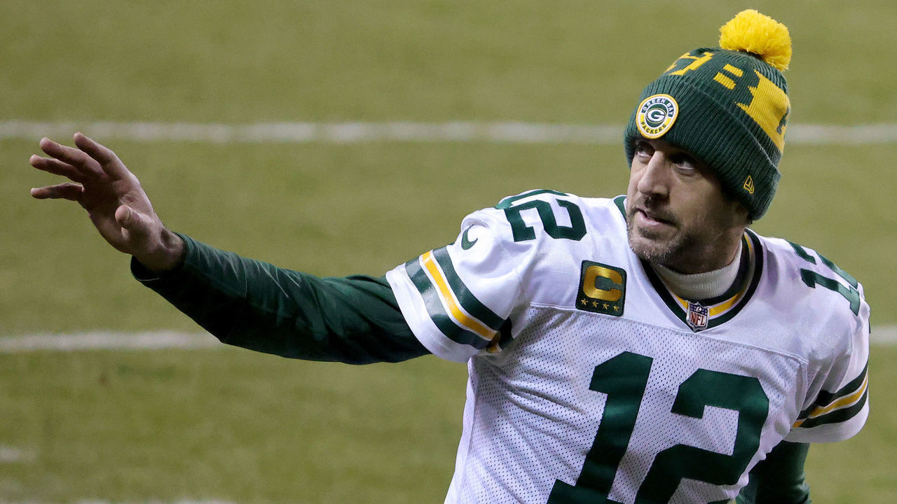 CHICAGO, ILLINOIS - JANUARY 03: Aaron Rodgers #12 of the Green Bay Packers waves after defeating the Chicago Bears in the game at Soldier Field on January 03, 2021 in Chicago, Illinois.