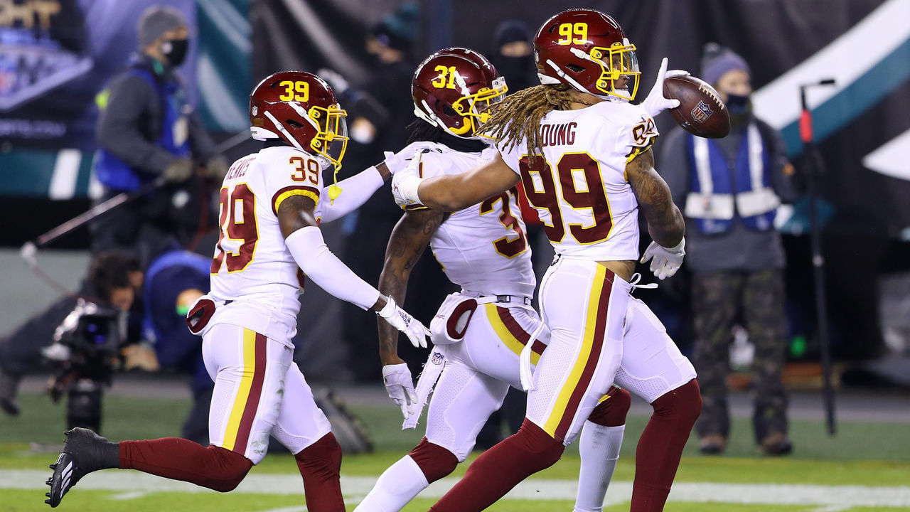 PHILADELPHIA, PENNSYLVANIA - JANUARY 03: Strong safety Kamren Curl #31 of the Washington Football Team celebrates with defensive end Chase Young #99 and defensive back Jeremy Reaves #39 after an interception during the first quarter of the game against the Philadelphia Eagles at Lincoln Financial Field on January 03, 2021 in Philadelphia, Pennsylvania.