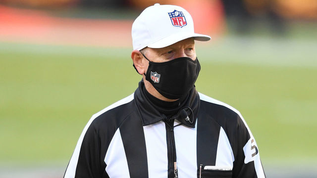 LANDOVER, MARYLAND - DECEMBER 27: A referee looks on while wearing a mask prior to the game between the Washington Football Team and the Carolina Panthers at FedExField on December 27, 2020 in Landover, Maryland.