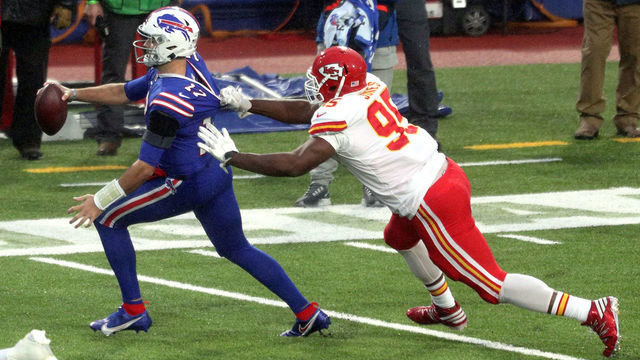 ORCHARD PARK, NEW YORK - OCTOBER 19: Josh Allen #17 of the Buffalo Bills is grabbed by Chris Jones #95 of the Kansas City Chiefs during the first half at Bills Stadium on October 19, 2020 in Orchard Park, New York.