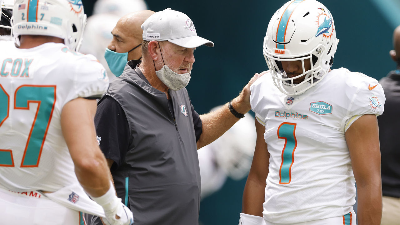 MIAMI GARDENS, FLORIDA - OCTOBER 04: Offensive coordinator Chan Gailey of the Miami Dolphins talks with Tua Tagovailoa #1 prior to the game against the Seattle Seahawks at Hard Rock Stadium on October 04, 2020 in Miami Gardens, Florida.