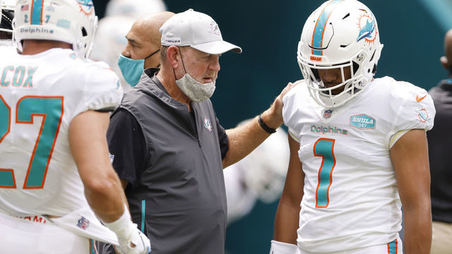 MIAMI GARDENS, FLORIDA - OCTOBER 04: Offensive coordinator Chan Gailey of the Miami Dolphins talks with Tua Tagovailoa #1 prior to the game against the Seattle Seahawks at Hard Rock Stadium on October 04, 2020 in Miami Gardens, Florida.