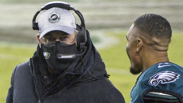 PHILADELPHIA, PA - JANUARY 03: Philadelphia Eagles head coach Doug Pederson and Philadelphia Eagles quarterback Jalen Hurts (2) chat during the game between the Washington Football Team and the Philadelphia Eagles on January 3, 2021 at Lincoln Financial Field in Philadelphia, PA.