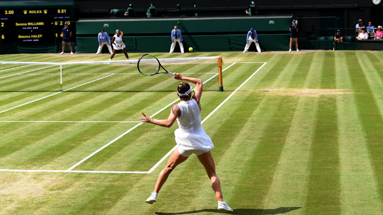 LONDON, ENGLAND - JULY 13: A general view inside centre court as Simona Halep of Romania plays a forehand in her Ladies' Singles final against Serena Williams of The United States during Day twelve of The Championships - Wimbledon 2019 at All England Lawn Tennis and Croquet Club on July 13, 2019 in London, England.