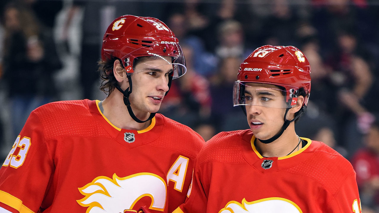 CALGARY, AB - JANUARY 18: Calgary Flames Center Sean Monahan (23) and Left Wing Johnny Gaudreau (13) talk between whistles during the second period of an NHL game where the Calgary Flames hosted the Detroit Red Wings on January 18, 2019, at the Scotiabank Saddledome in Calgary, AB.