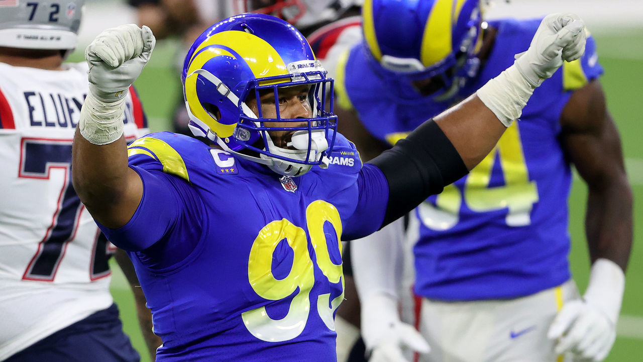 INGLEWOOD, CALIFORNIA - DECEMBER 10: Aaron Donald #99 of the Los Angeles Rams celebrates a turnover on downs during the fourth quarter in the game against the New England Patriots at SoFi Stadium on December 10, 2020 in Inglewood, California.