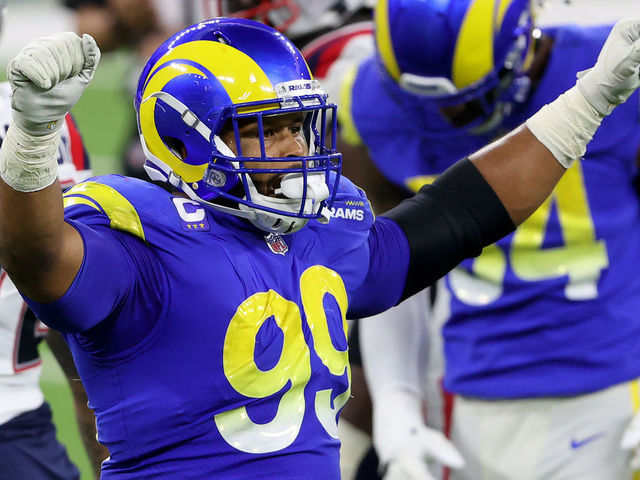INGLEWOOD, CALIFORNIA - DECEMBER 10: Aaron Donald #99 of the Los Angeles Rams celebrates a turnover on downs during the fourth quarter in the game against the New England Patriots at SoFi Stadium on December 10, 2020 in Inglewood, California.