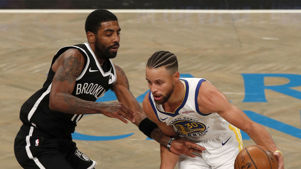 NEW YORK, NEW YORK - DECEMBER 22: (NEW YORK DAILIES OUT) Stephen Curry #30 of the Golden State Warriors in action against Kyrie Irving #11 of the Brooklyn Nets at Barclays Center on December 22, 2020 in New York City. The Nets defeated the Warriors 125-99. NOTE TO USER: User expressly acknowledges and agrees that, by downloading and/or using this photograph, user is consenting to the terms and conditions of the Getty Images License Agreement.