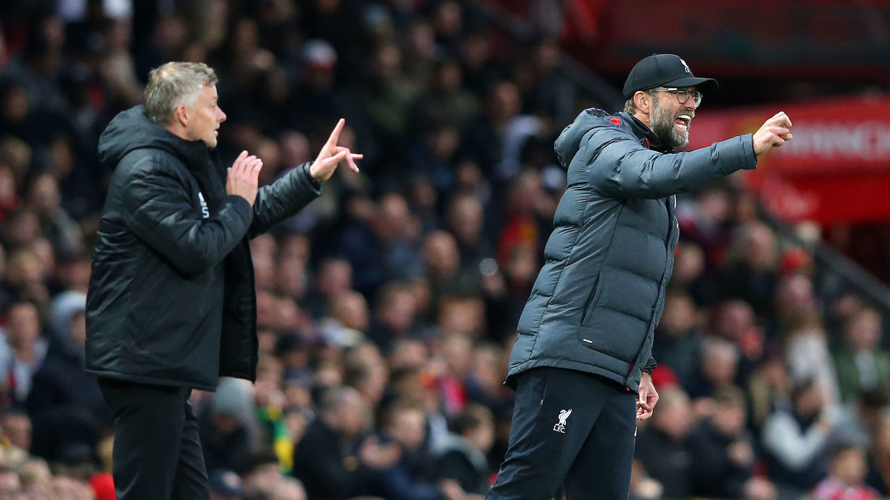 MANCHESTER, ENGLAND - OCTOBER 20: Ole Gunnar Solskjaer, Manager of Manchester United and Jurgen Klopp, Manager of Liverpool gives their side instructions during the Premier League match between Manchester United and Liverpool FC at Old Trafford on October 20, 2019 in Manchester, United Kingdom.
