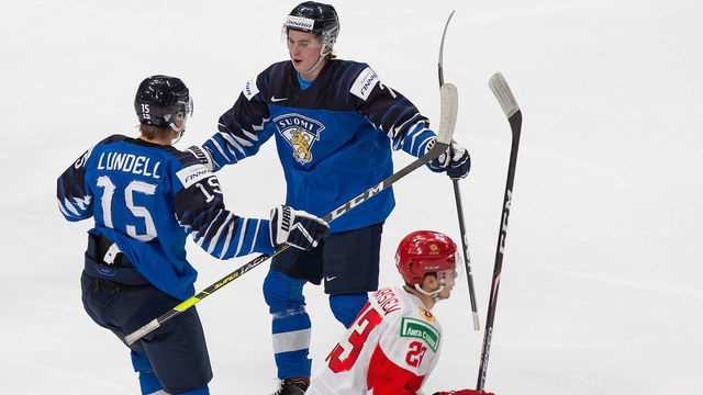 EDMONTON, AB - JANUARY 05: Anton Lundell #15 and Topi Niemela #7 of Finland celebrate a goal as Yegor Afanasiev #23 of Russia skates off during the 2021 IIHF World Junior Championship bronze medal game at Rogers Place on January 5, 2021 in Edmonton, Canada.