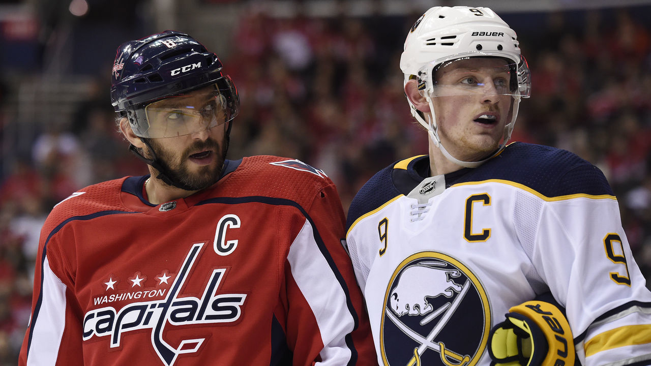 WASHINGTON, DC - DECEMBER 15: Alex Ovechkin #8 of the Washington Capitals and Jack Eichel #9 of the Buffalo Sabres look on during a stopage in play in the second period at Capital One Arena on December 15, 2018 in Washington, DC.