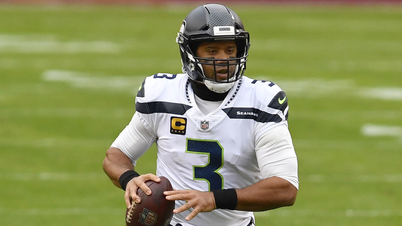 LANDOVER, MD - DECEMBER 20: Seahawks quarterback Russell Wilson (3) throws on the run during the Seattle Seahawks vs. Washington Football Team NFL game December 20, 2000 at FedEx Field in Landover, MD.