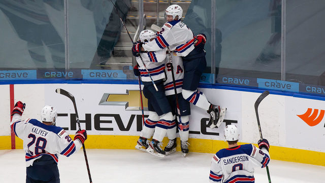EDMONTON, AB - JANUARY 05: Trevor Zegras #9, Alex Turcotte #15 and Drew Helleson #2 of the United States celebrate a goal against Canada during the 2021 IIHF World Junior Championship gold medal game at Rogers Place on January 5, 2021 in Edmonton, Canada.