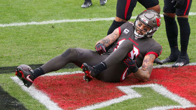 TAMPA, FL - JANUARY 03: Mike Evans (13) of the Buccaneers reaches towards his knee after the play during the regular season game between the Atlanta Falcons and the Tampa Bay Buccaneers on January 03, 2021 at Raymond James Stadium in Tampa, Florida.