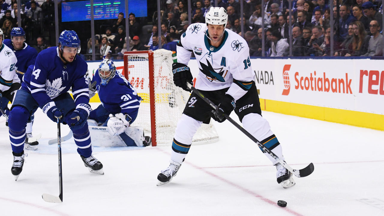 TORONTO, ON - NOVEMBER 28: Toronto Maple Leafs center Auston Matthews (34) battles for a puck with San Jose Sharks center Joe Thornton (19) during the first period in a game between the San Jose Sharks and the Toronto Maple Leafs at the Scotiabank Arena in Toronto, Ontario Canada.