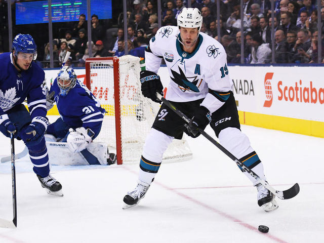 TORONTO, ON - NOVEMBER 28: Toronto Maple Leafs center Auston Matthews (34) battles for a puck with San Jose Sharks center Joe Thornton (19) during the first period in a game between the San Jose Sharks and the Toronto Maple Leafs at the Scotiabank Arena in Toronto, Ontario Canada.