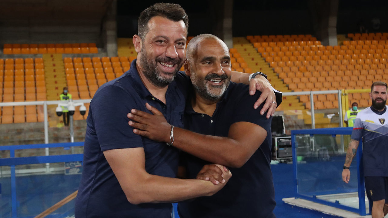 LECCE, ITALY - AUGUST 02: Head coach of Parma, Roberto D'Aversa (L) hugs Fabio Liverani, head coach of Lecce during the Serie A match between US Lecce and Parma Calcio at Stadio Via del Mare on August 02, 2020 in Lecce, Italy.