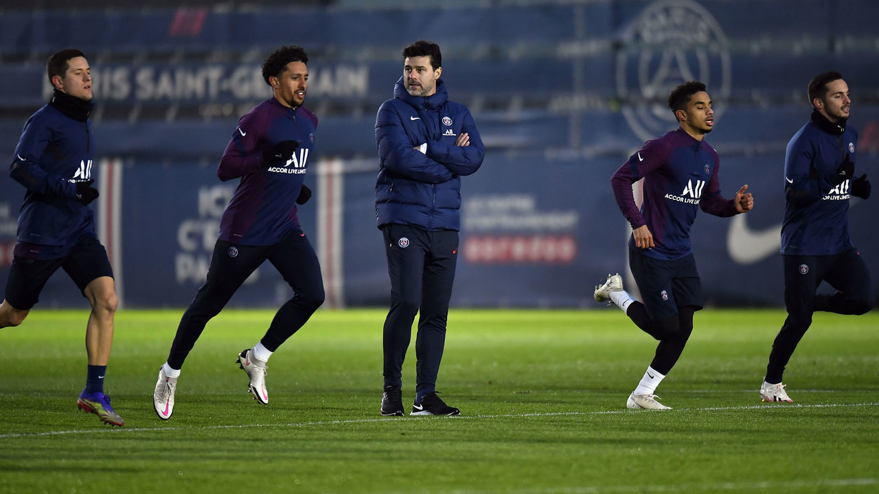 PARIS, FRANCE - JANUARY 03: Newly appointed head coach Mauricio Pochettino looks on as players run beside him during a Paris Saint-Germain training session at Ooredoo Center on January 03, 2021 in Paris, France.