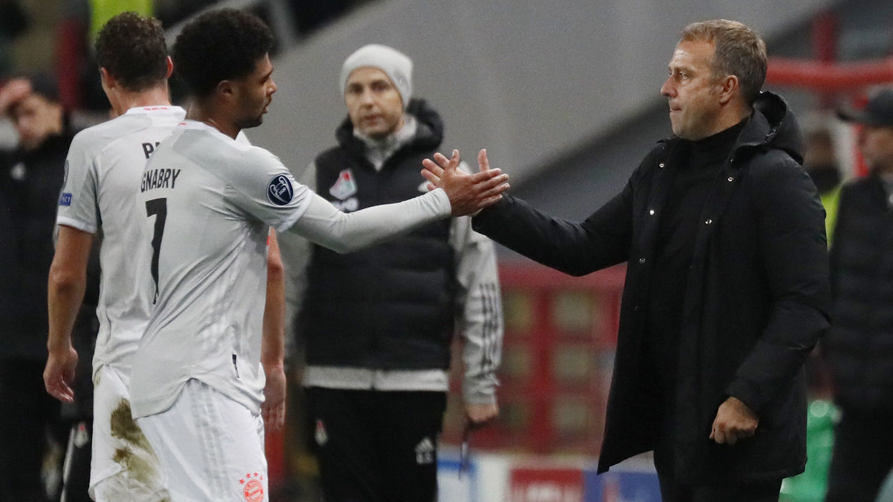MOSCOW, RUSSIA - OCTOBER 27: Serge Gnabry of Bayern Munich celebrates with Hans-Dieter Flick, Head Coach of Bayern Munich after the UEFA Champions League Group A stage match between Lokomotiv Moskva and FC Bayern Muenchen at RZD Arena on October 27, 2020 in Moscow, Russia. A limited number of spectators will be in attendance as Covid-19 pandemic restrictions ease.