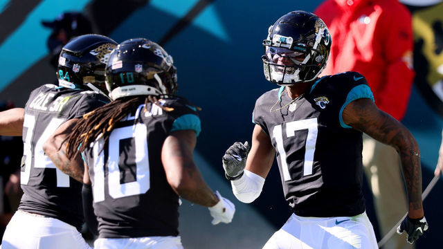 JACKSONVILLE, FLORIDA - DECEMBER 27: DJ Chark Jr. #17 of the Jacksonville Jaguars celebrates with Laviska Shenault Jr. #10 and Keelan Cole Sr. #84 after scoring a touchdown against the Chicago Bears at TIAA Bank Field on December 27, 2020 in Jacksonville, Florida.