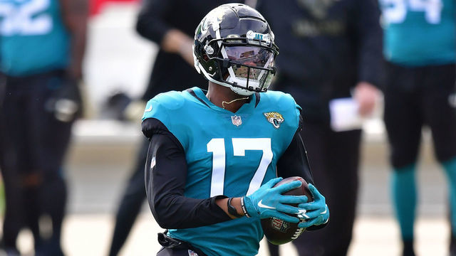 JACKSONVILLE, FLORIDA - NOVEMBER 08: D.J. Chark #17 of the Jacksonville Jaguars catches a pass for a touchdown in front of Michael Thomas #28 of the Houston Texans during the first quarter of a game at TIAA Bank Field on November 08, 2020 in Jacksonville, Florida.