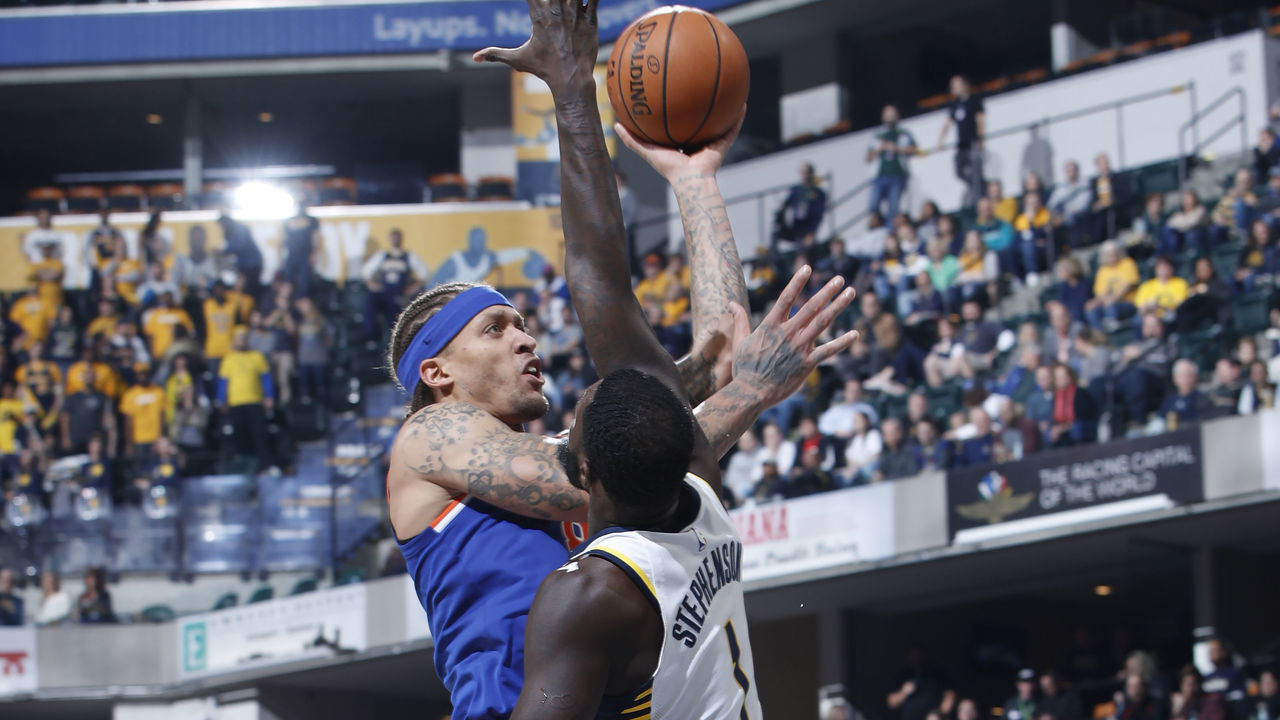 INDIANAPOLIS, IN - DECEMBER 04: Michael Beasley #8 of the New York Knicks goes to the basket against Lance Stephenson #1 of the Indiana Pacers in the first half of a game at Bankers Life Fieldhouse on December 4, 2017 in Indianapolis, Indiana. NOTE TO USER: User expressly acknowledges and agrees that, by downloading and or using the photograph, User is consenting to the terms and conditions of the Getty Images License Agreement.