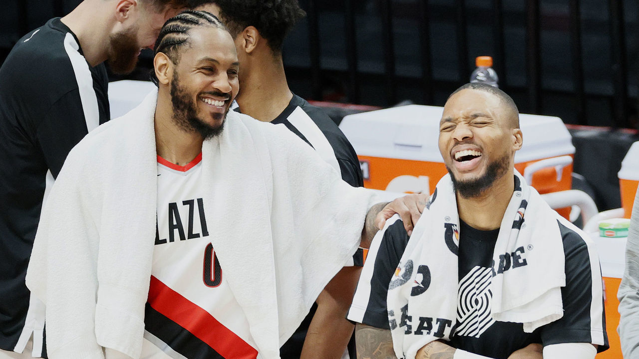 PORTLAND, OREGON - JANUARY 07: Carmelo Anthony #00 of the Portland Trail Blazers and Damian Lillard #0 of the Portland Trail Blazers react after defeating Minnesota Timberwolves 135-117 at Moda Center on January 07, 2021 in Portland, Oregon.