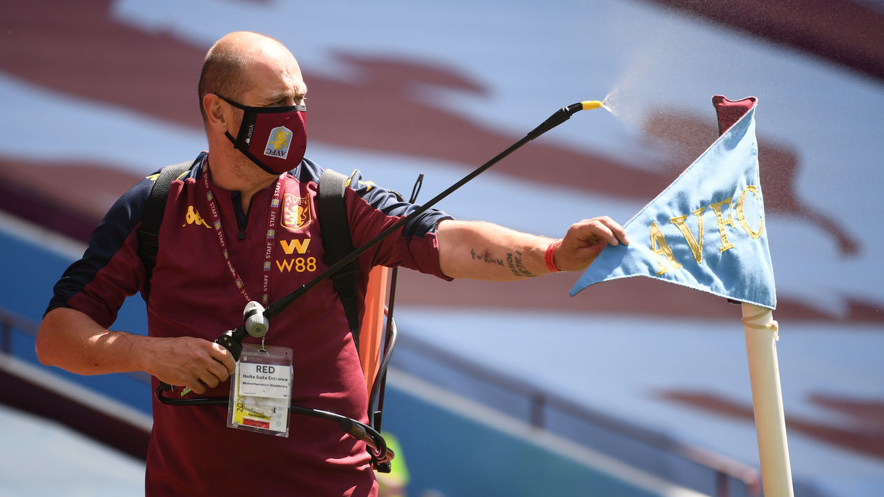 BIRMINGHAM, ENGLAND - JUNE 27: Ground staff disinfects the corner flag prior to the Premier League match between Aston Villa and Wolverhampton Wanderers at Villa Park on June 27, 2020 in Birmingham, England.