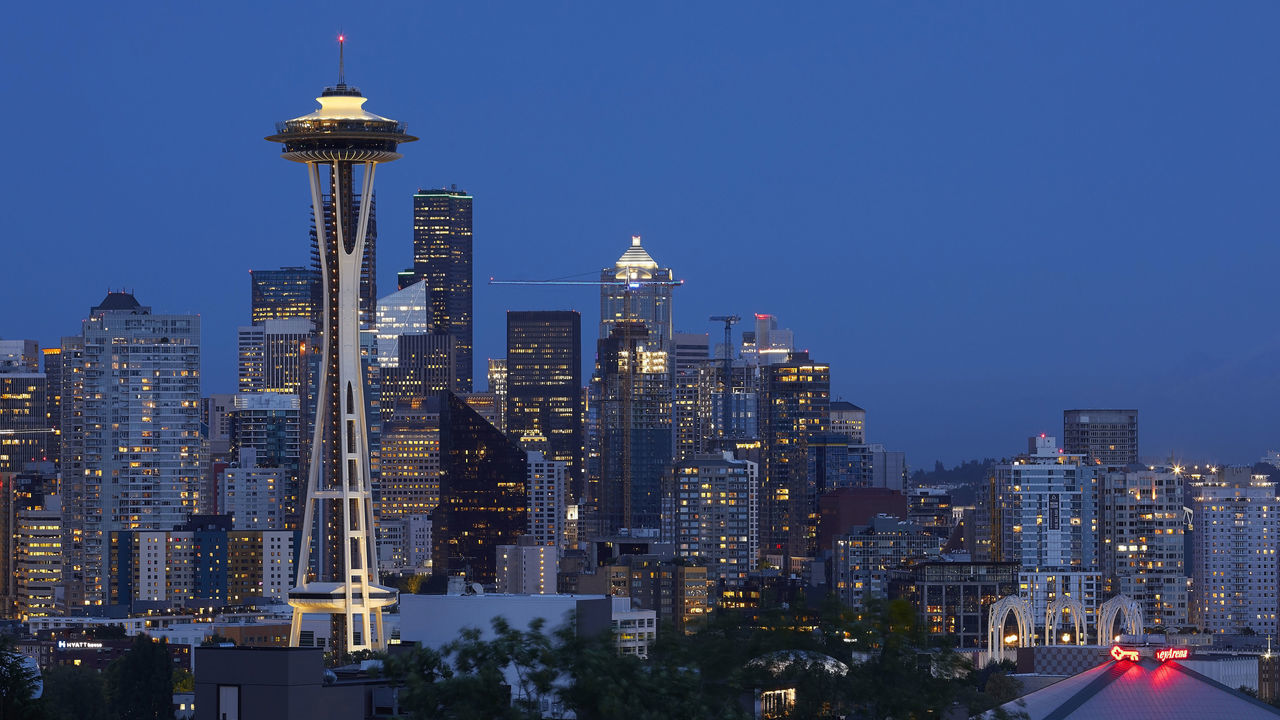 Illuminated tower and city at night. Space Needle, Seattle, United States. Architect: Olson Kundig, 2020. (Photo by: View Pictures/Hufton+Crow/Universal Images Group via Getty Images)