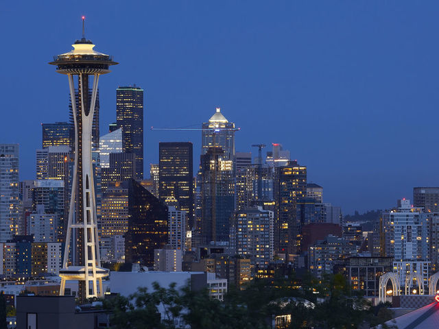 Illuminated tower and city at night. Space Needle, Seattle, United States. Architect: Olson Kundig, 2020. (Photo by: View Pictures/Hufton+Crow/Universal Images Group via Getty Images)