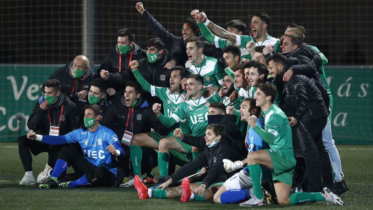 BARCELONA, SPAIN - JANUARY 06: Players of Cornella celebrate victory after the Copa del Rey match between Cornella and Atletico de Madrid at Camp Municipal de Cornella on January 06, 2021 in Barcelona, Spain. Sporting stadiums around Spain remain under strict restrictions due to the Coronavirus Pandemic as Government social distancing laws prohibit fans inside venues resulting in games being played behind closed doors.