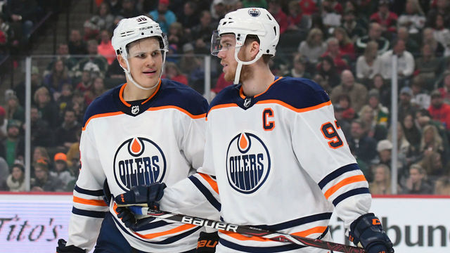 ST. PAUL, MN - DECEMBER 16: Edmonton Oilers Center Connor McDavid (97) chats with Edmonton Oilers Right Wing Jesse Puljujarvi (98) during a NHL game between the Minnesota Wild and Edmonton Oilers on December 16, 2017 at Xcel Energy Center in St. Paul, MN.The Oilers defeated the Wild 3-2.