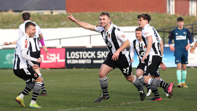 Chorley's Connor Hall (centre) celebrates scoring his side's first goal of the game during the Emirates FA Cup third round match at Victory Park, Chorley.