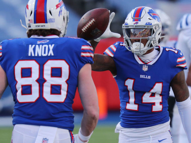 ORCHARD PARK, NEW YORK - JANUARY 09: Stefon Diggs #14 reacts with Dawson Knox #88 of the Buffalo Bills after making a first-down reception during the second half of the AFC Wild Card playoff game against the Indianapolis Colts at Bills Stadium on January 09, 2021 in Orchard Park, New York.