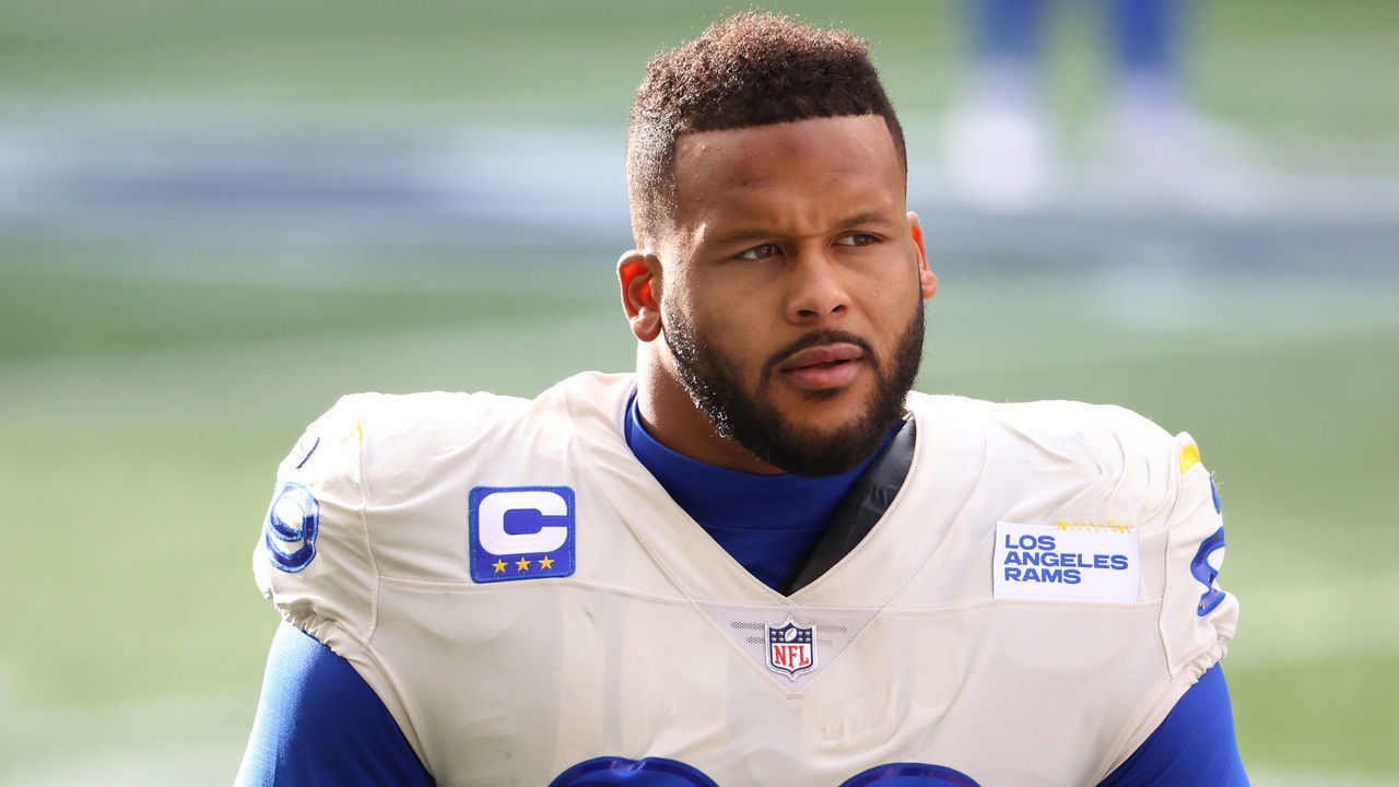 SEATTLE, WASHINGTON - JANUARY 09: Defensive end Aaron Donald #99 of the Los Angeles Rams looks on during pre-game activates prior to the NFC Wild Card Playoff game against the Seattle Seahawks at Lumen Field on January 09, 2021 in Seattle, Washington.