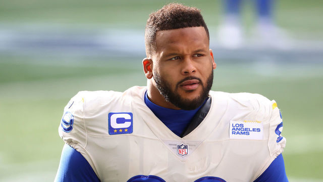 SEATTLE, WASHINGTON - JANUARY 09: Defensive end Aaron Donald #99 of the Los Angeles Rams looks on during pre-game activates prior to the NFC Wild Card Playoff game against the Seattle Seahawks at Lumen Field on January 09, 2021 in Seattle, Washington.