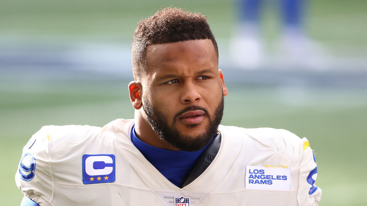 SEATTLE, WASHINGTON - JANUARY 09: Defensive end Aaron Donald #99 of the Los Angeles Rams looks on during pre-game activates prior to the NFC Wild Card Playoff game against the Seattle Seahawks at Lumen Field on January 09, 2021 in Seattle, Washington.