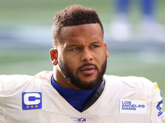 SEATTLE, WASHINGTON - JANUARY 09: Defensive end Aaron Donald #99 of the Los Angeles Rams looks on during pre-game activates prior to the NFC Wild Card Playoff game against the Seattle Seahawks at Lumen Field on January 09, 2021 in Seattle, Washington.
