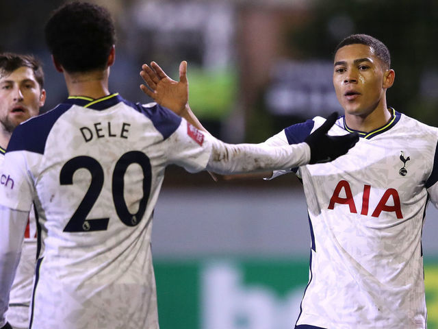 CROSBY, ENGLAND - JANUARY 10: Carlos Vinicius of Tottenham Hotspur celebrates with teammates Ben Davies and Dele Alli after scoring their team's first goal during the FA Cup Third Round match between Marine and Tottenham Hotspur at Rossett Park on January 10, 2021 in Crosby, England. Sporting stadiums around England remain under strict restrictions due to the Coronavirus Pandemic as Government social distancing laws prohibit fans inside venues resulting in games being played behind closed doors.