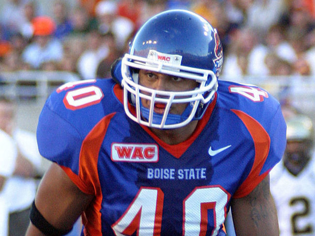 BOISE, ID - SEPTEMBER 4, 2004: Andy Avalos, #40 linebacker of the Boise State University Broncos football team runs up field to make the play against the University of Idaho Vandals on September 4, 2004 at Bronco Stadium in Boise, Idaho. The Broncos won 38-20.