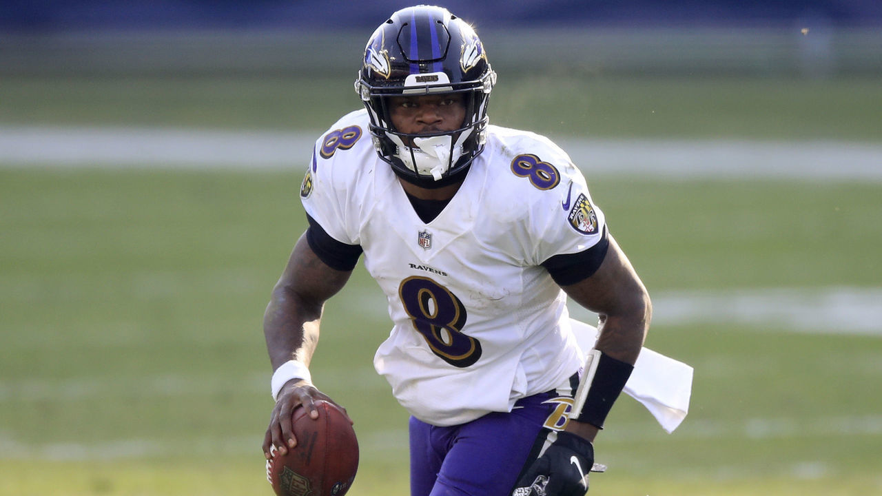NASHVILLE, TENNESSEE - JANUARY 10: Quarterback Lamar Jackson #8 of the Baltimore Ravens carries the ball for yardage during the fourth quarter of their AFC Wild Card Playoff game against the Tennessee Titans at Nissan Stadium on January 10, 2021 in Nashville, Tennessee.