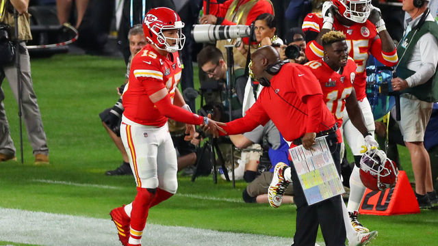 MIAMI GARDENS, FL - FEBRUARY 02: Kansas City Chiefs Quarterback Patrick Mahomes (15) shakes hands with Kansas City Chiefs offensive coordinator Eric Bieniemy after scoring a touchdown during the first quarter of Super Bowl LIV on February 2, 2020 at Hard Rock Stadium in Miami Gardens, FL.