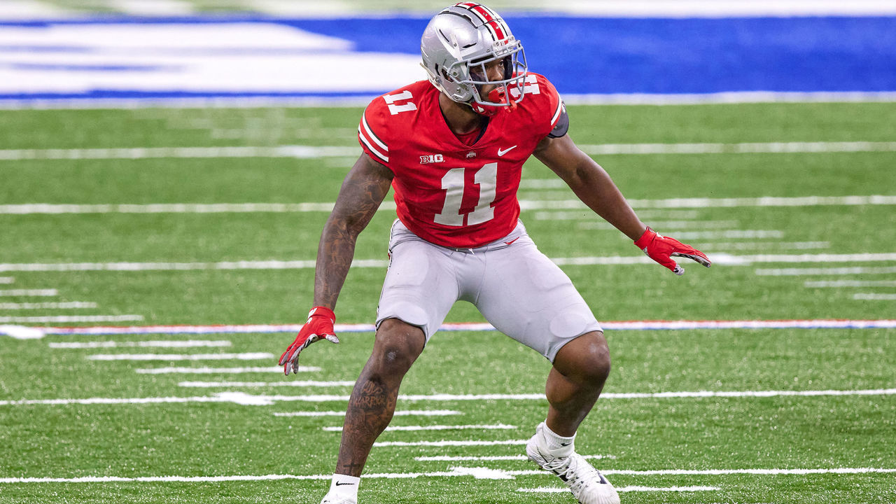 INDIANAPOLIS, IN - DECEMBER 19: Ohio State Buckeyes defensive end Tyreke Smith (11) runs in action during the Big Ten Championship game between the Ohio State Buckeyes and the Northwestern Wildcats on December 19, 2020 at Lucas Oil stadium, in Indianapolis, IN.