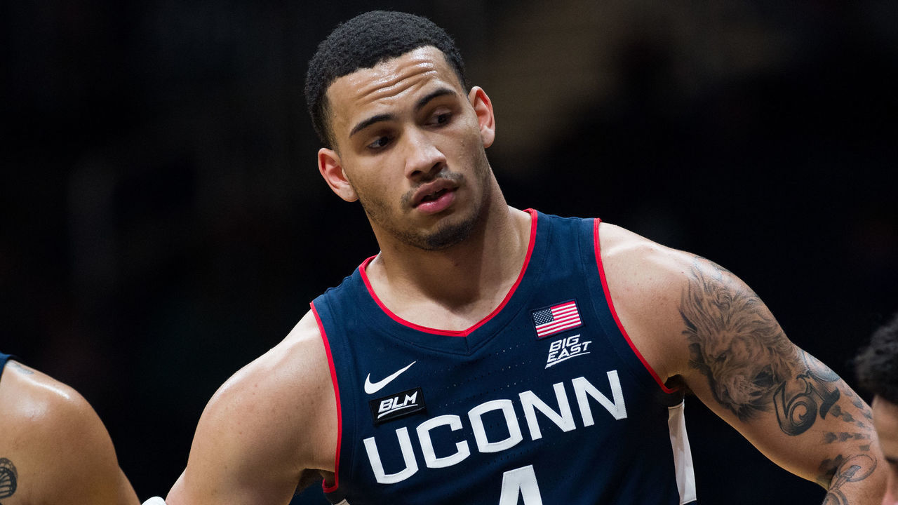 INDIANAPOLIS, IN - JANUARY 09: UConn Huskies guard Tyrese Martin (4) stands on the free throw lane during the men's college basketball game between the UConn Huskies and Butler Bulldogs on January 9, 2021, at Hinkle Fieldhouse in Indianapolis, IN.